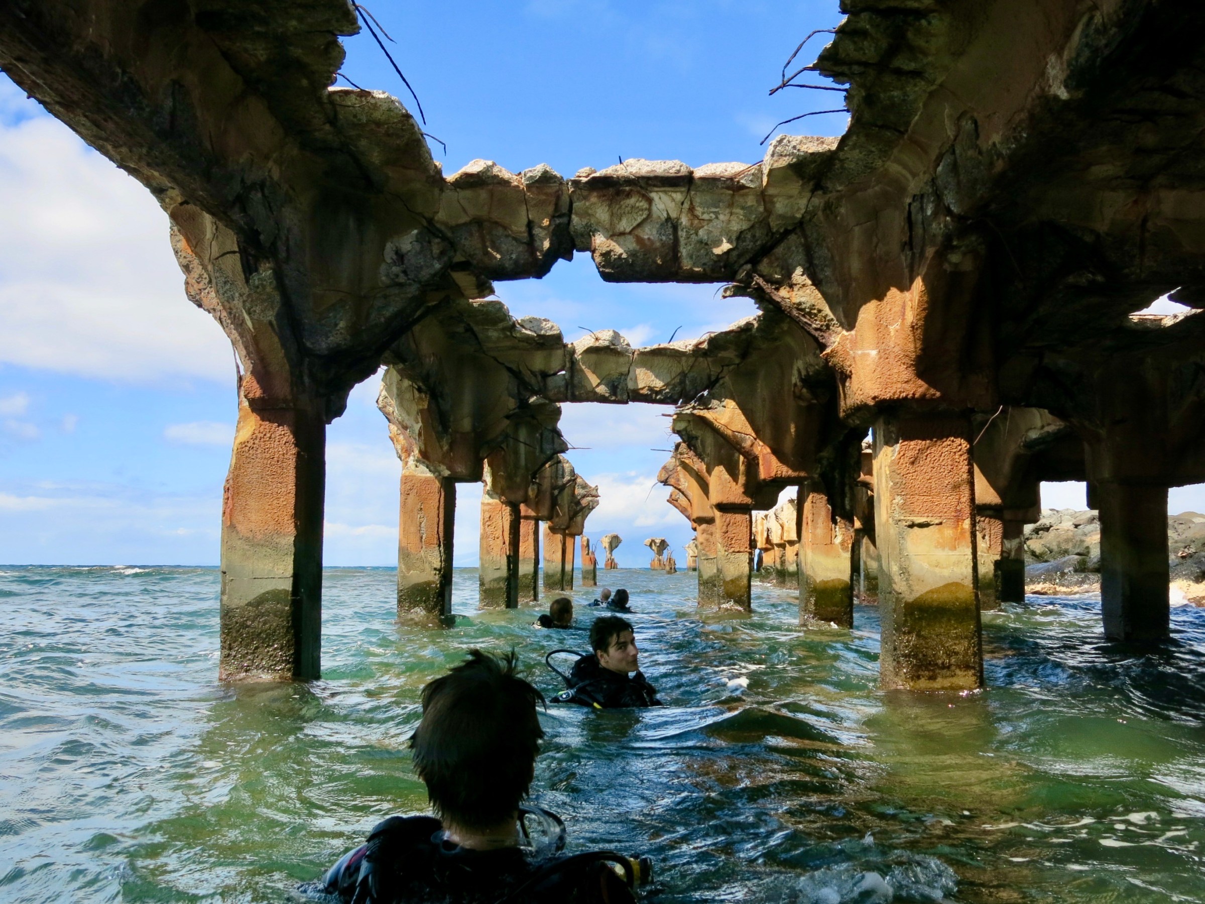 Maui scuba divers surfacing under Mala Wharf.