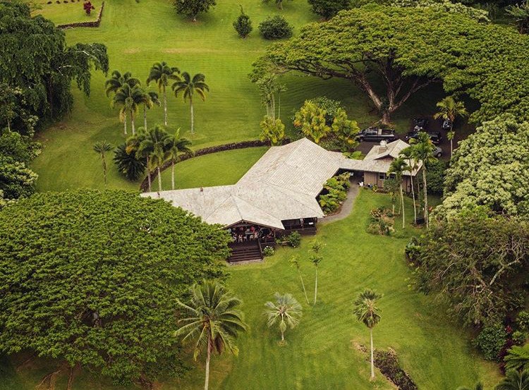 Aerial view of Ala Kukui cultural retreat surrounded by tropical grounds in Hāna, Maui.
