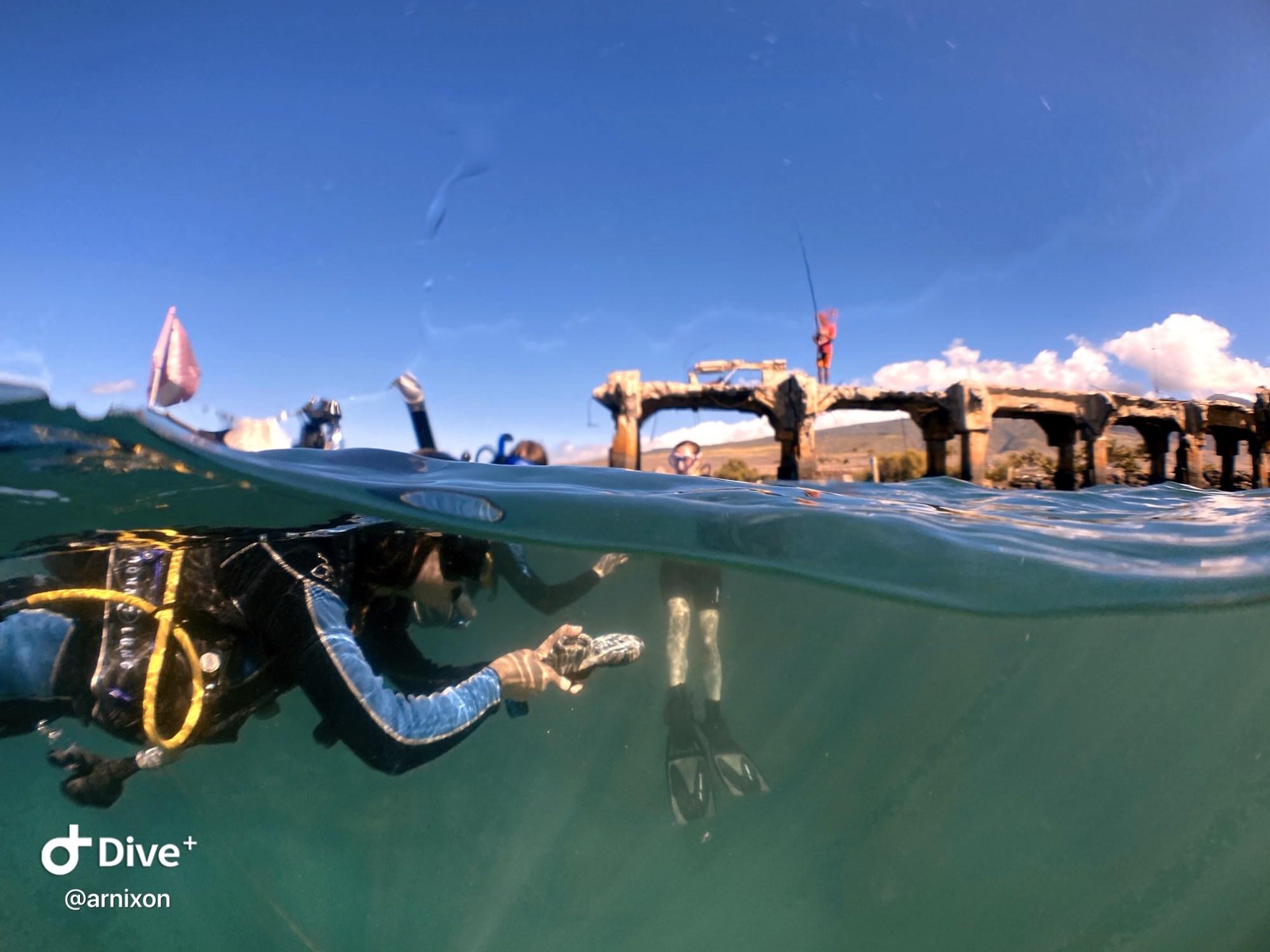 Maui scuba diver checking the air gauge